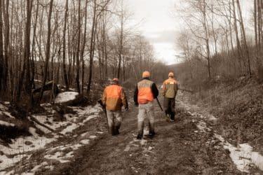 bird hunters walking on trail