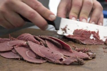 Goose Pastrami Sandwich meat sliced at Camp Chef Cook-off
