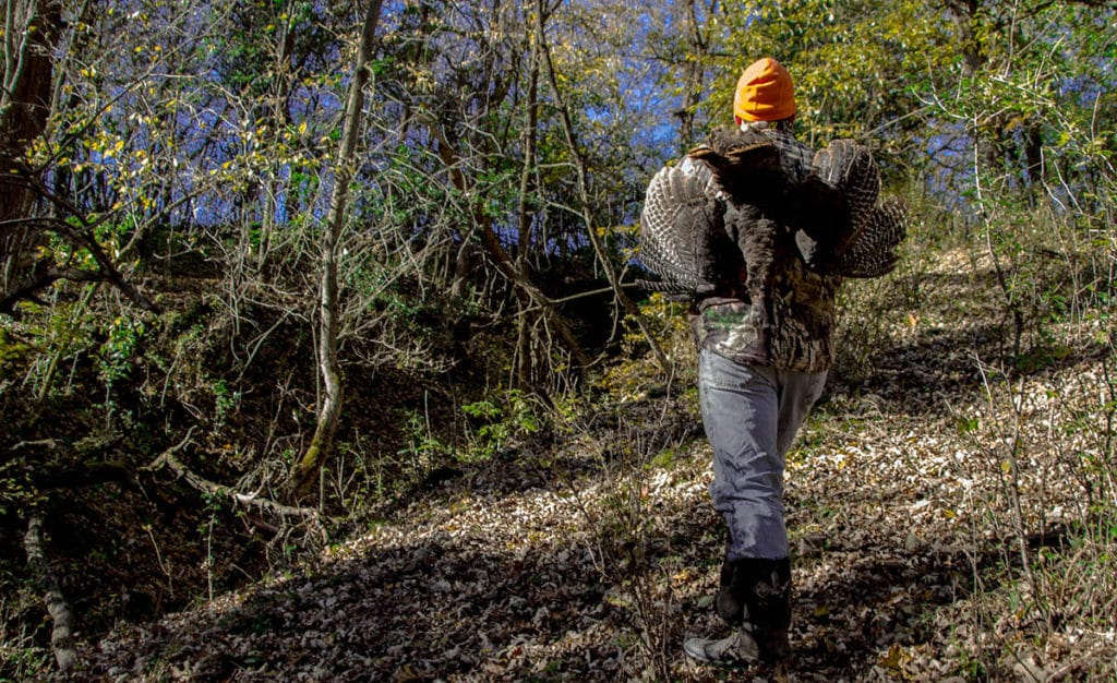 Jamie Carlson carrying wild turkeys Modern Carnivore