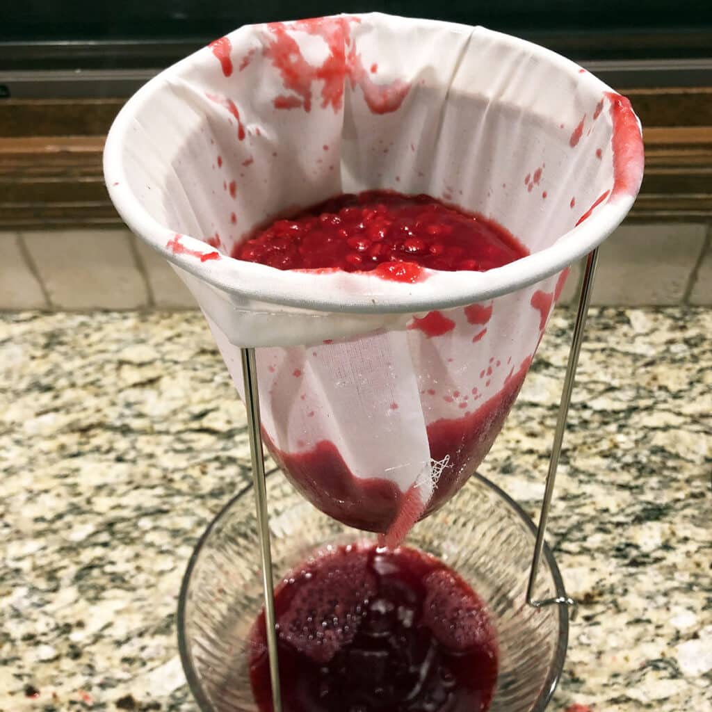 Running HIghbush Cranberry puree through a sieve